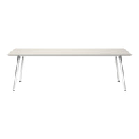 Minimalist white rectangular table with a textured surface and sleek silver legs.