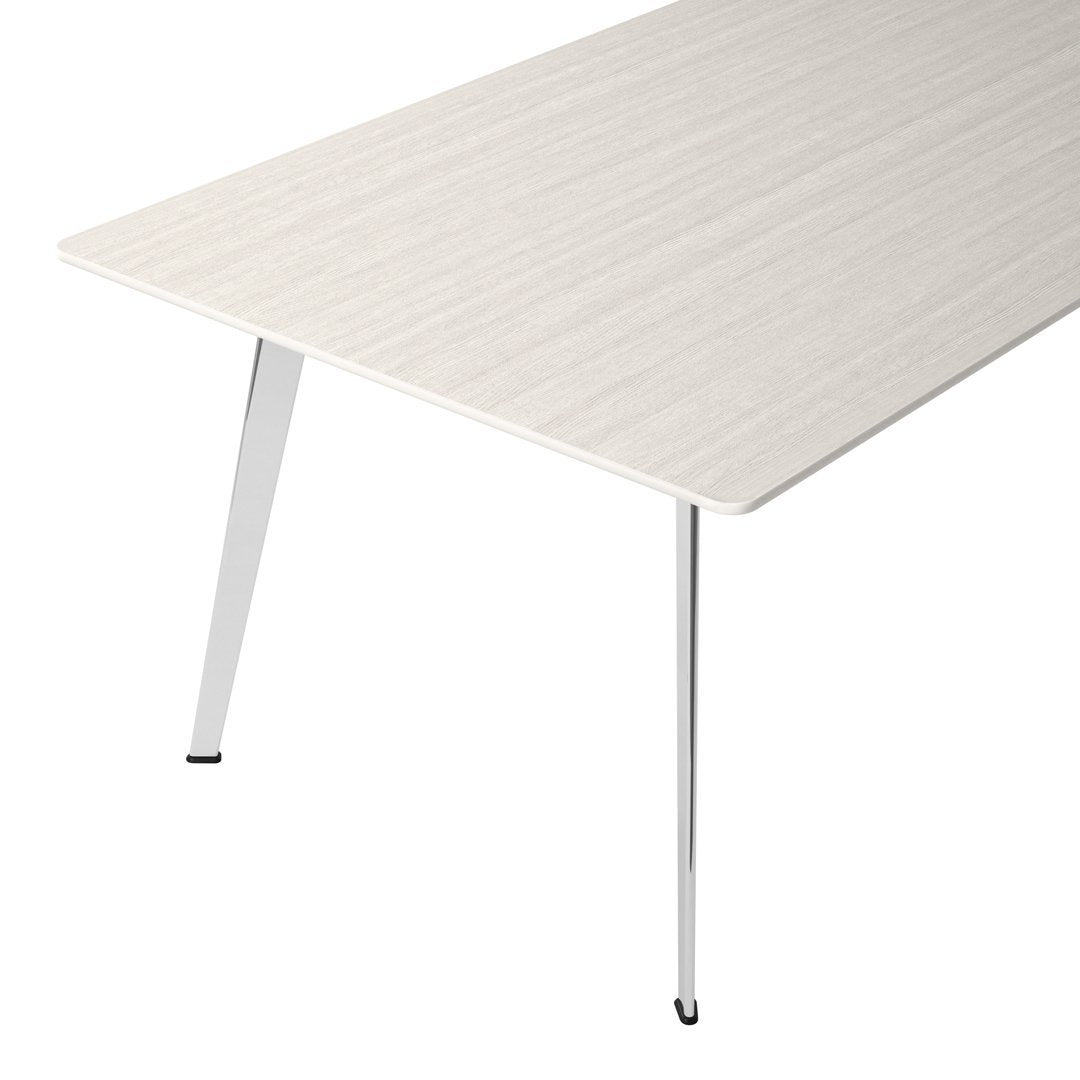 Light wood grain tabletop with sleek chrome legs, featuring a minimalist design and neutral color palette.