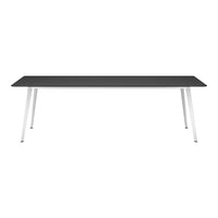 Sleek black tabletop with modern white legs, showcasing a minimalist design and contemporary color palette.