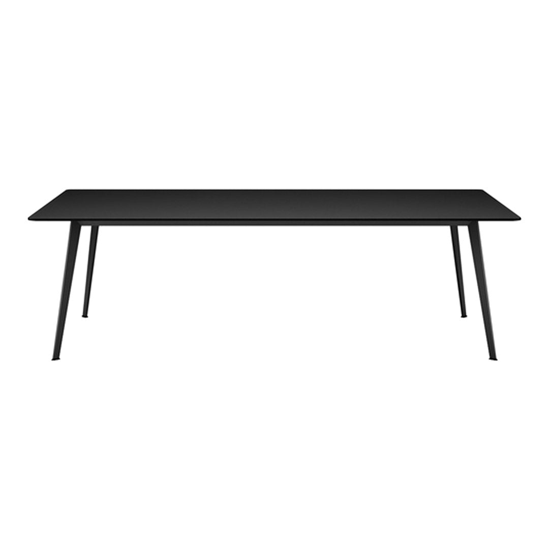 Modern black dining table with a sleek, minimalist design and tapered legs, perfect for contemporary interiors.