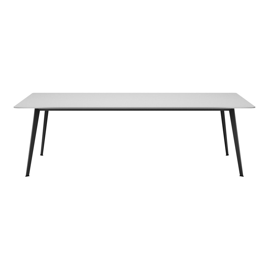 White rectangular table with sleek black legs, minimalist design, ideal for modern interiors.