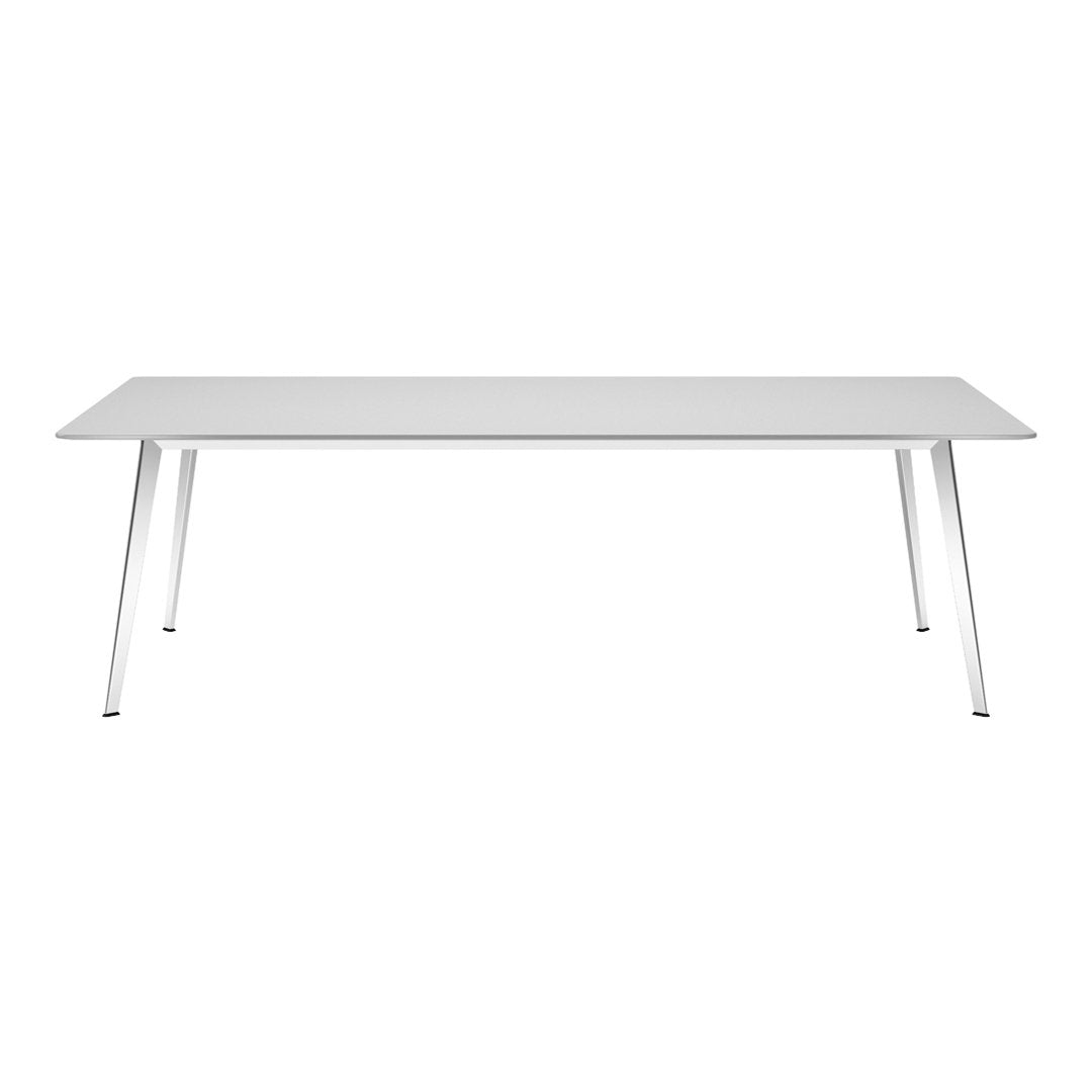 Modern white dining table with sleek metallic legs, complementing minimalistic decor styles. Perfect for any space.