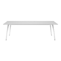 Modern white dining table with sleek metallic legs, complementing minimalistic decor styles. Perfect for any space.