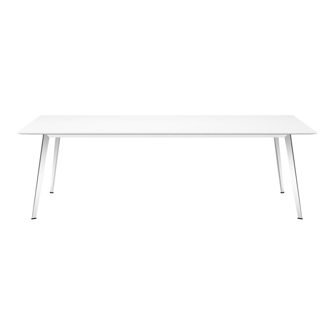 White modern table with sleek silver legs, featuring a minimalist design and no visible patterns. Perfect for any decor.