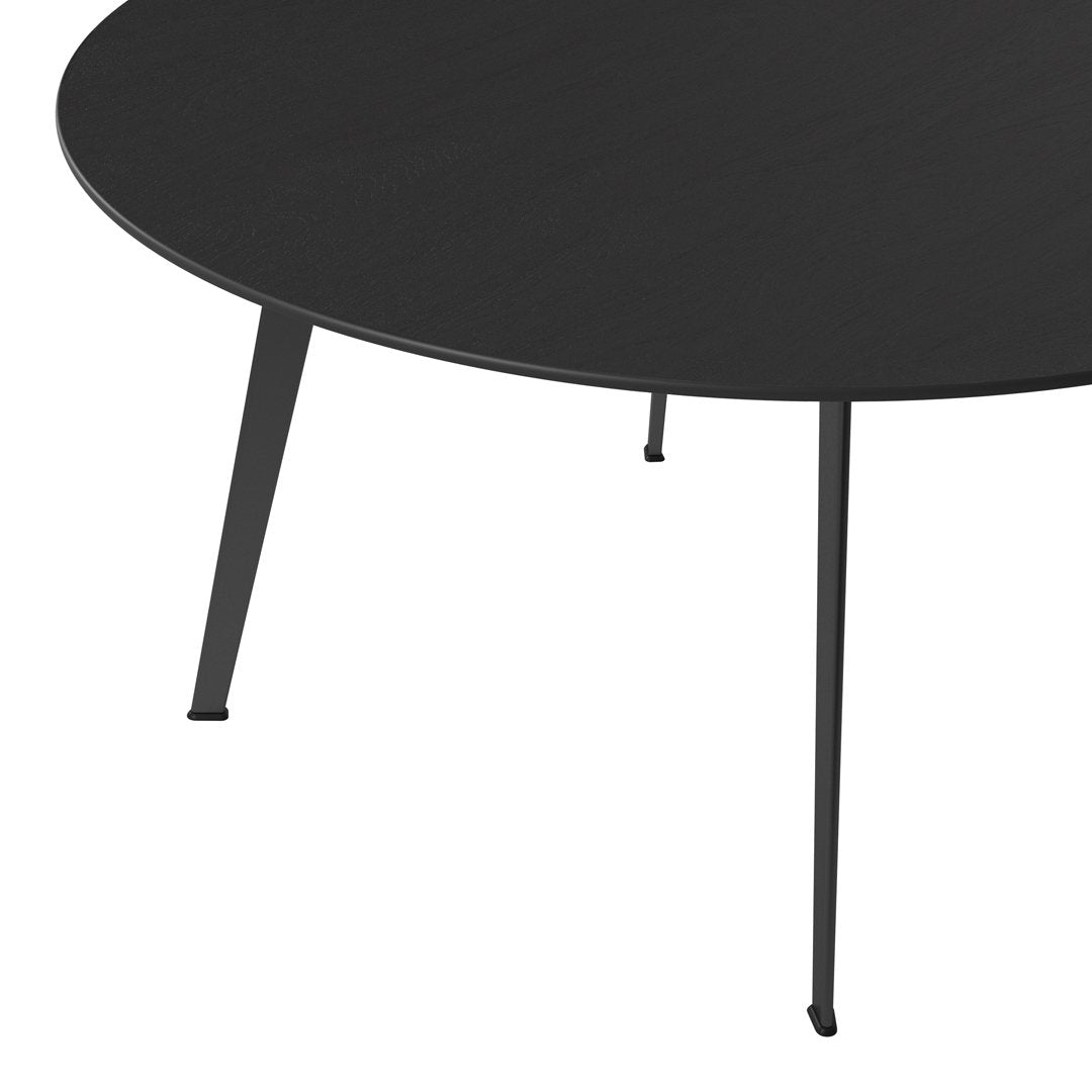 Black round coffee table with matte finish and slender black legs, perfect for modern interiors.