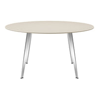 Round beige tabletop with light wood grain pattern and sleek silver legs. Modern design for contemporary spaces.