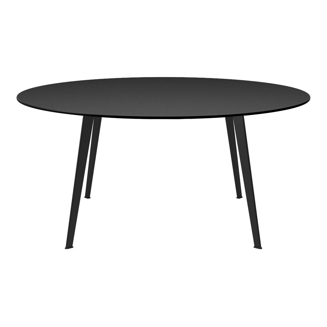 Round black dining table with sleek, modern design and slender black legs, perfect for contemporary interiors.