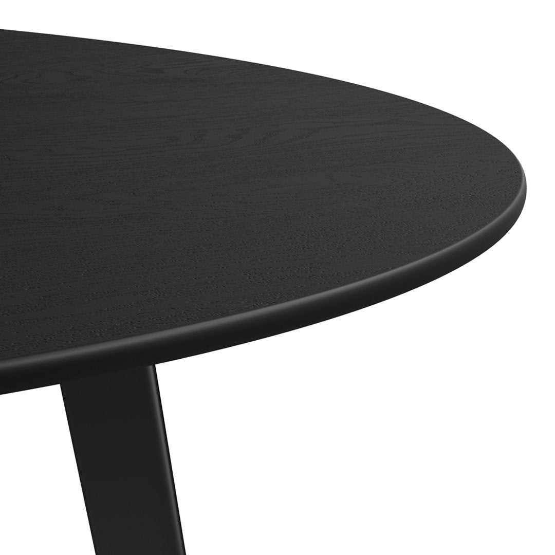 Black round table surface with a smooth finish, showcasing a sleek and modern design. Ideal for contemporary spaces.