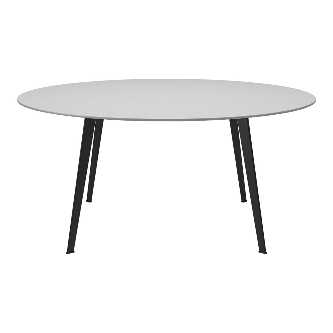 Round table with a sleek white top and black metal legs, featuring a modern minimalist design.