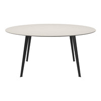 "Round table with a light beige top and sleek black legs, featuring a smooth, minimalistic design."