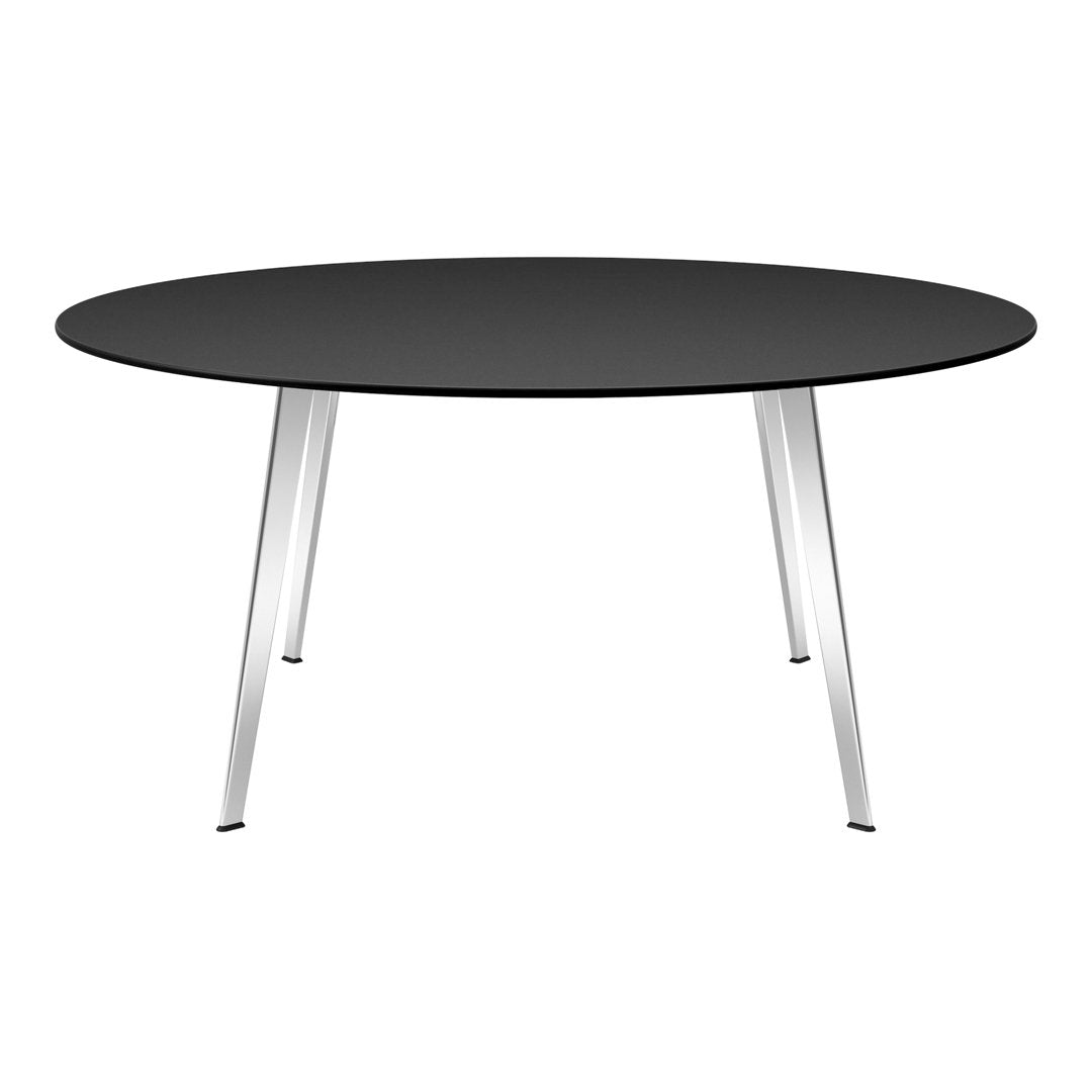 Black round table with sleek silver legs, perfect for modern decor. Minimalist design enhances any space.