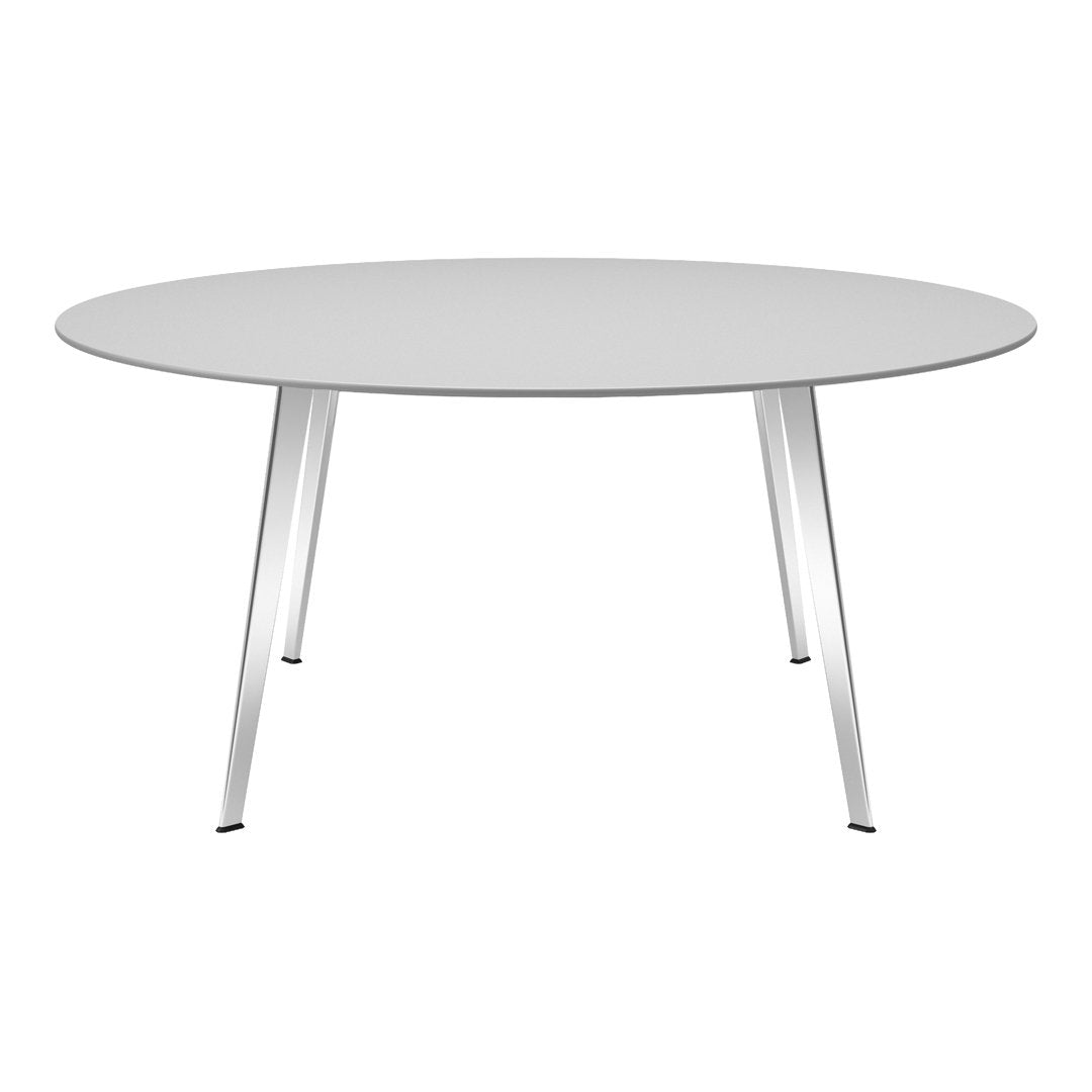 Round white tabletop with sleek silver legs, featuring a minimalist and modern design. Ideal for contemporary spaces.