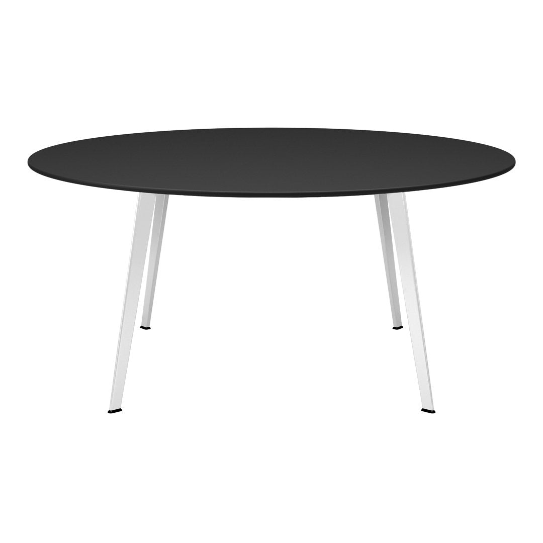 Round black table with sleek white legs, perfect for modern decor. Minimalist design adds elegance to any space.