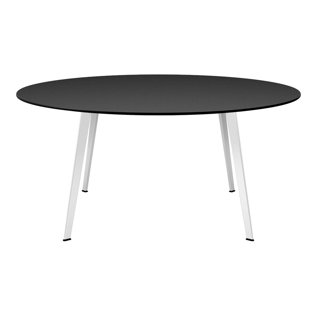 Round black tabletop with sleek silver legs, perfect for modern dining or workspace aesthetics.