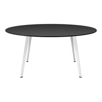 Round black tabletop with sleek silver legs, perfect for modern dining or workspace aesthetics.