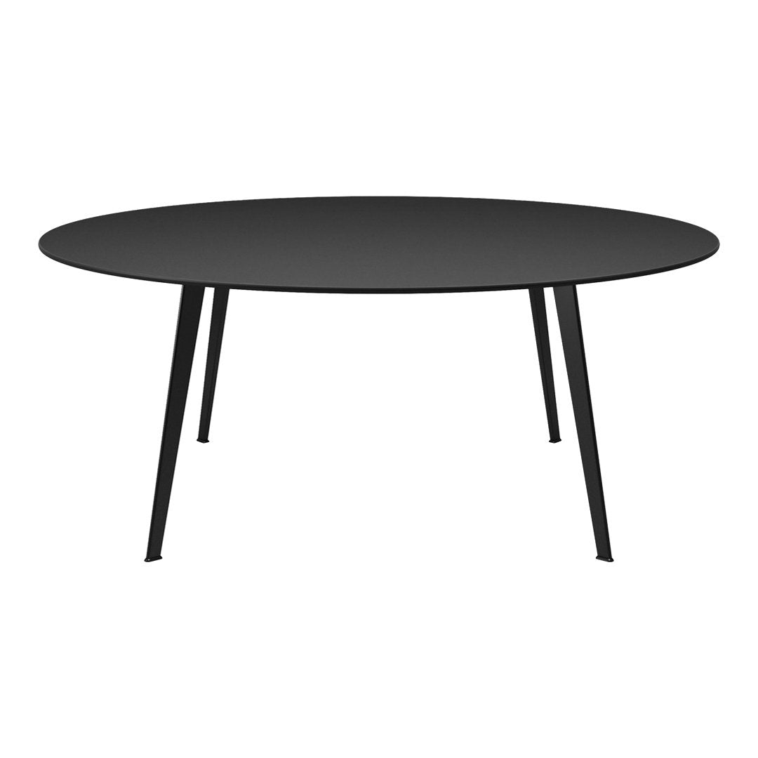 Round black table with sleek, matte finish and minimalist black legs, perfect for modern decor.