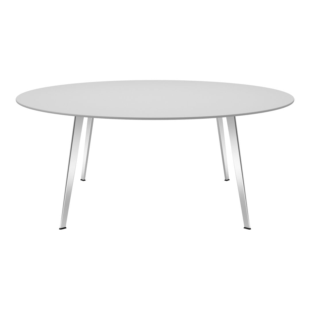 Round white dining table with sleek silver legs, showcasing a minimalist design and smooth surfaces. Ideal for modern decor.
