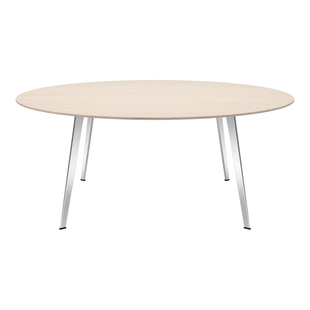 Light wood circular tabletop with a smooth finish, complemented by sleek silver metal legs. Modern and minimalistic design.