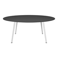 Round black tabletop with sleek white legs, modern minimalist design, ideal for contemporary home decor.