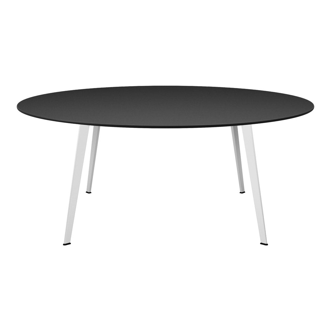 Round black tabletop with sleek white legs, offering a modern and minimalist design for any decor.