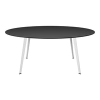 Round black tabletop with sleek white legs, offering a modern and minimalist design for any decor.