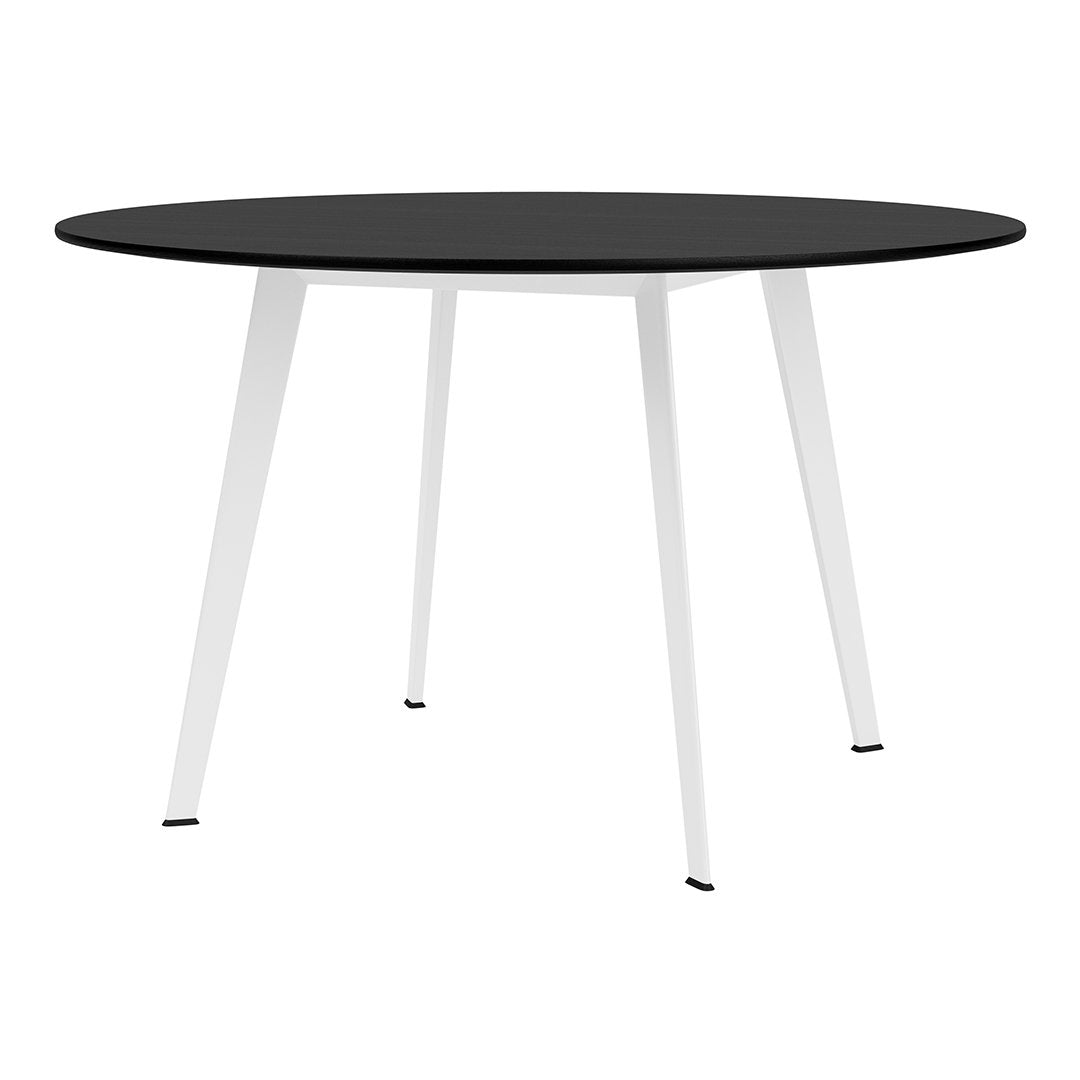 Round black tabletop with sleek white legs, featuring a minimalist design for modern decor.