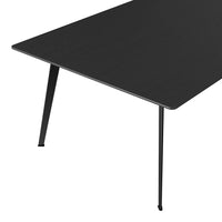 Black tabletop with a sleek wood grain pattern and slender black metal legs for a modern aesthetic.