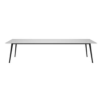 Sleek white tabletop with black legs, featuring a minimalist design and a modern, clean aesthetic.