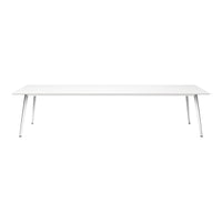 Modern white dining table with sleek silver legs, featuring a minimalist design and smooth, clean surface.