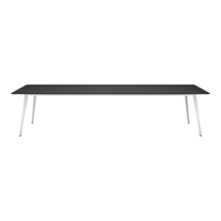 Sleek black tabletop with minimalist white legs, offering a modern and stylish design for any space.