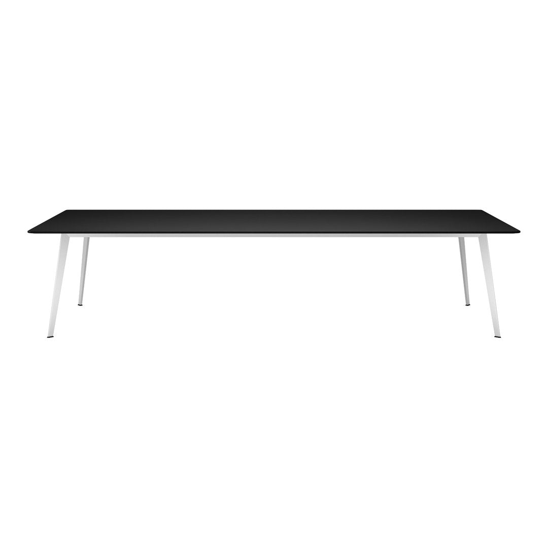 Black rectangular table with sleek white legs, minimalistic design, perfect for modern interiors.