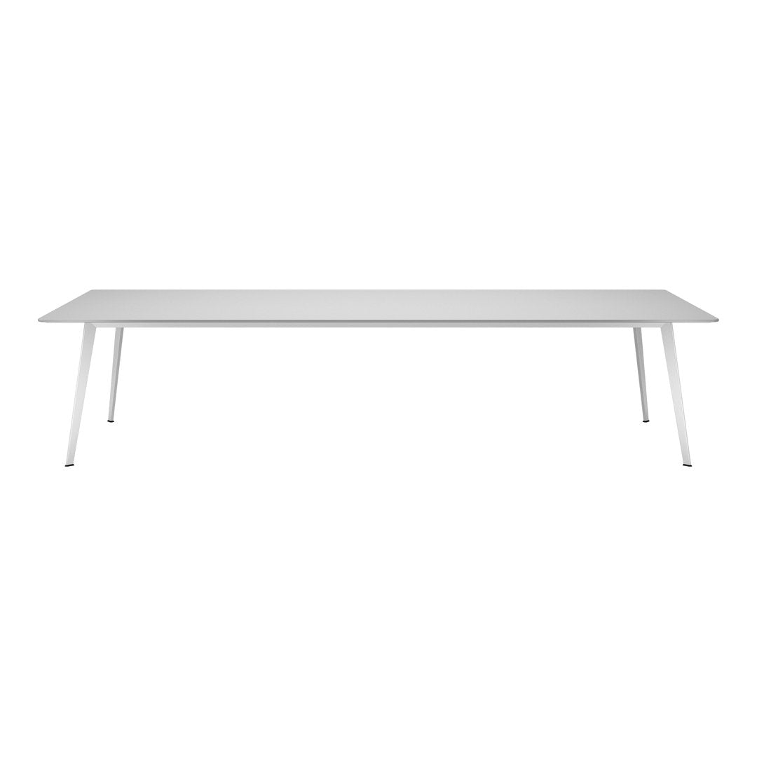 Sleek white dining table with a smooth finish and minimalist design, perfect for modern home decor.