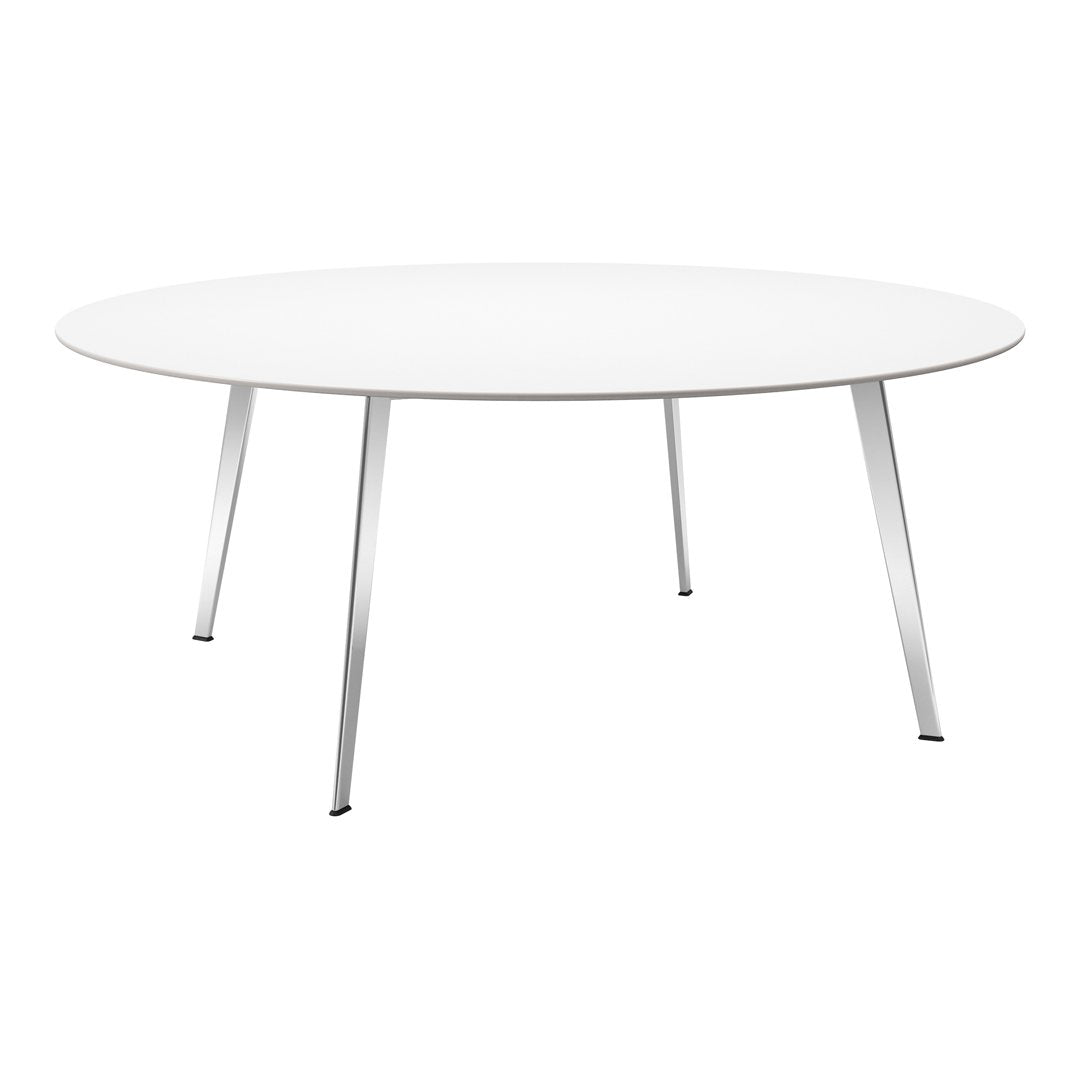 Round white table with sleek silver legs, minimalist design and smooth surface, perfect for modern interiors.