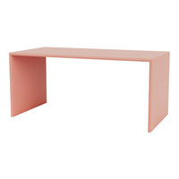 Peach-colored minimalist desk with a sleek, modern design and clean lines. Perfect for contemporary spaces.