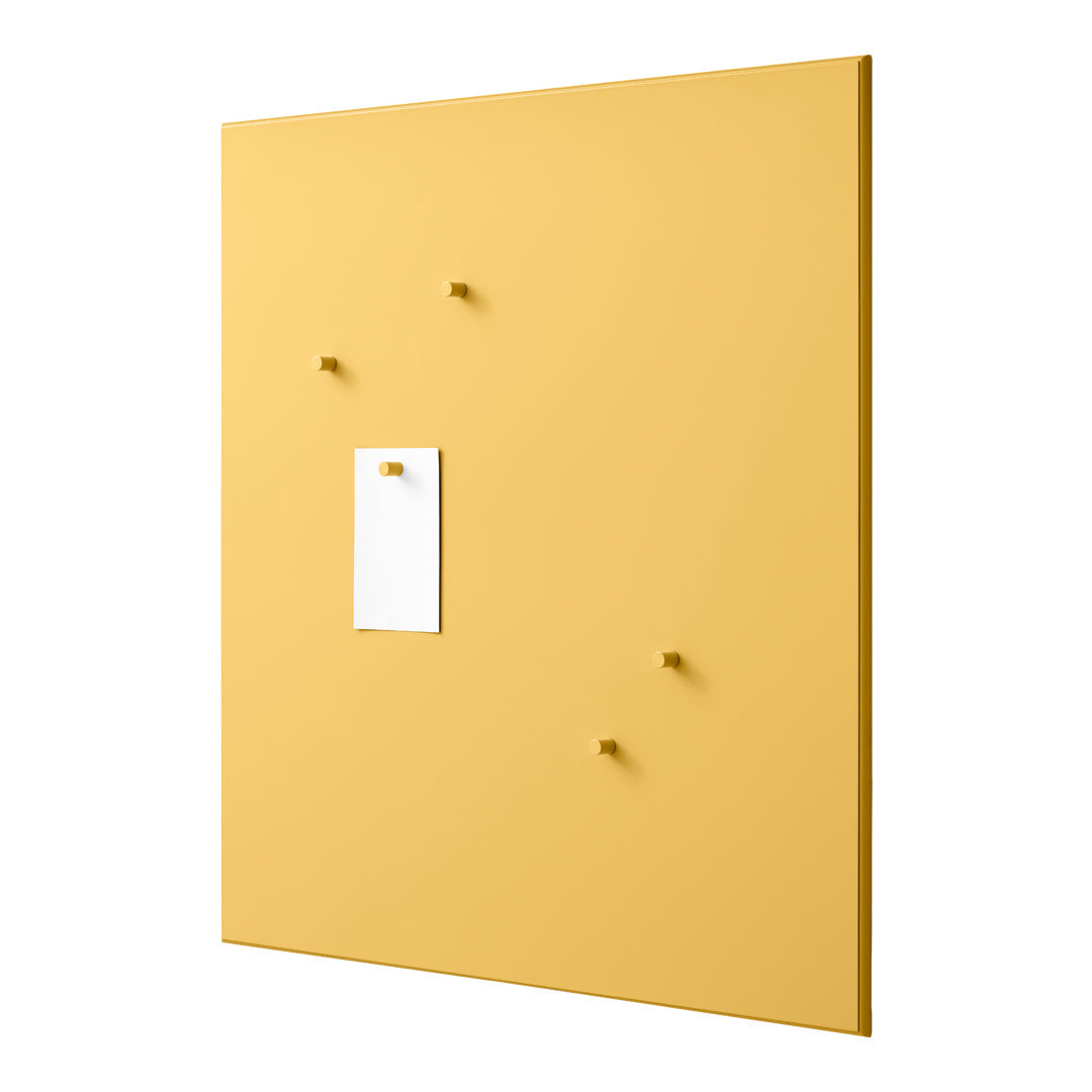 Yellow wall panel with minimalist design, featuring white note holder and matching yellow pegs. Perfect for organization.