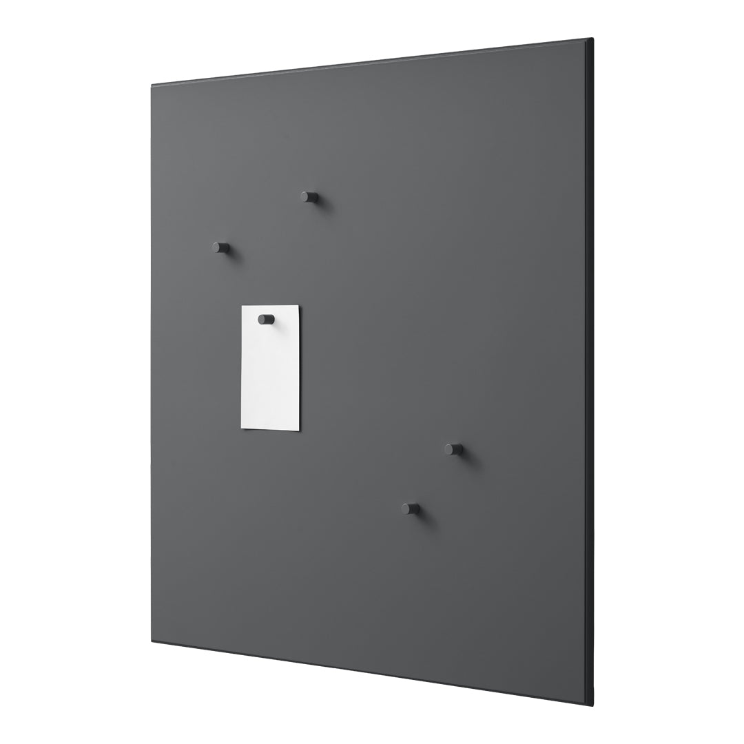 Gray wall board with five black knobs and a white note holder, featuring a sleek, modern design.