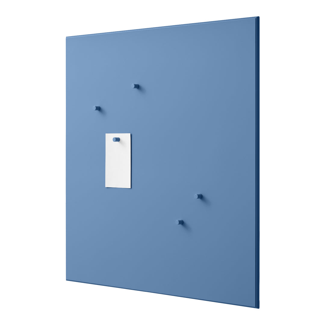 Blue wall panel with white note, featuring subtle round hooks for a modern, minimalist design.