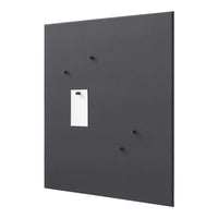 Black wall panel with small black hooks and a white note holder, featuring a sleek and minimalist design.