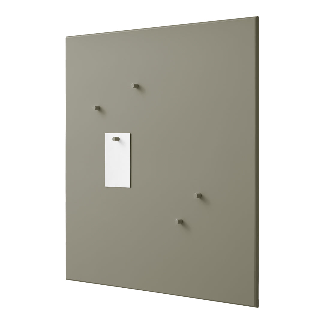 Textured gray wall panel with four matching pegs and a white note holder. Elegant and minimalistic design.