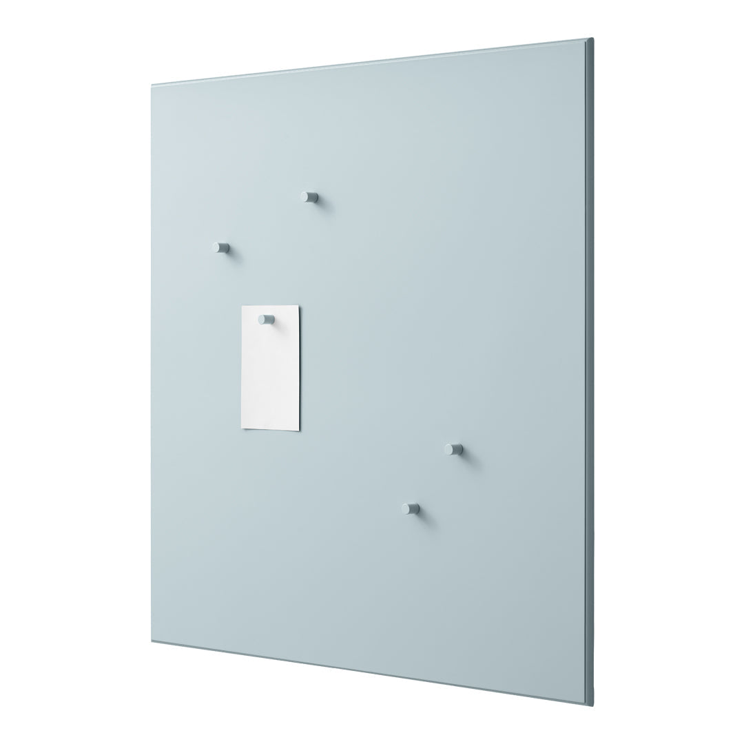 Light blue wall panel with minimalist design and small round knobs for a modern, clean aesthetic.