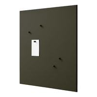 Olive green wall panel with four black pegs and a white note holder, featuring a minimalist design.