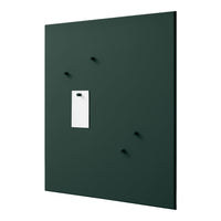 Dark green wall panel featuring a white insert and black hooks, creating a modern and minimalist design.