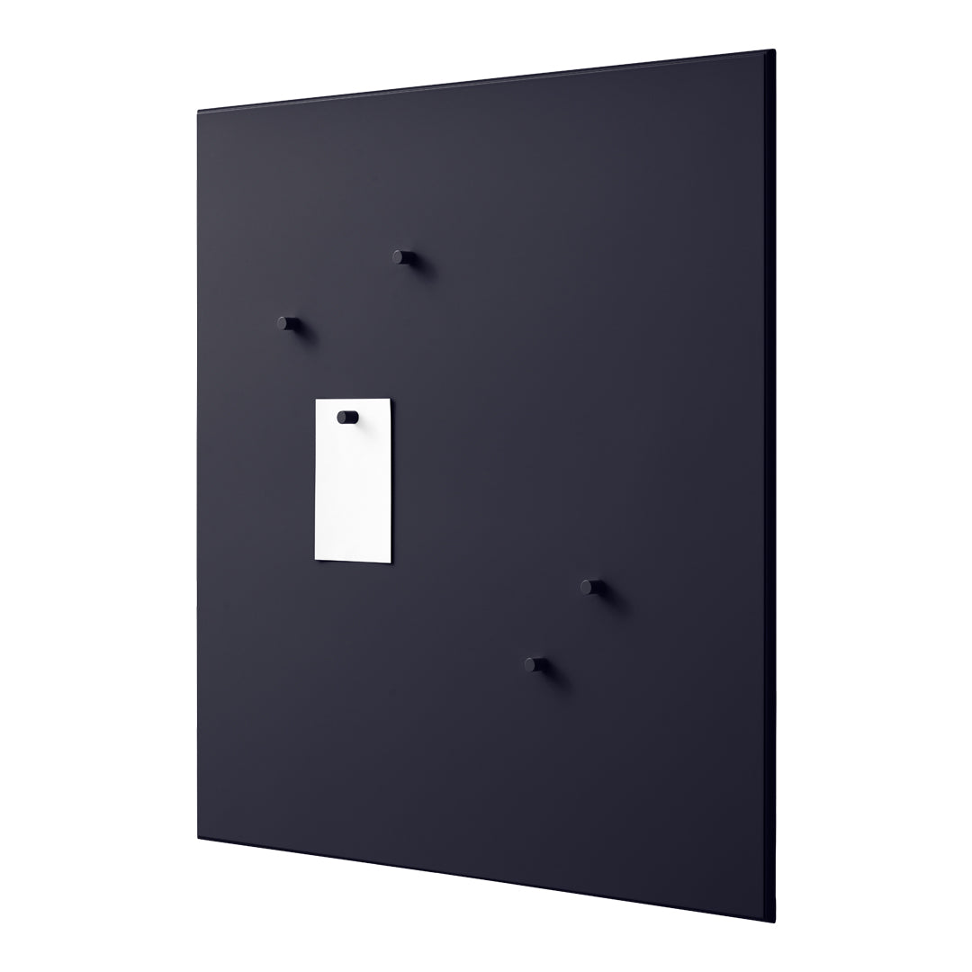 Black wall panel featuring smooth texture and minimal white accent with pegs for versatile mounting.