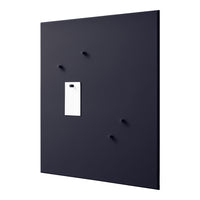 Black wall panel featuring smooth texture and minimal white accent with pegs for versatile mounting.