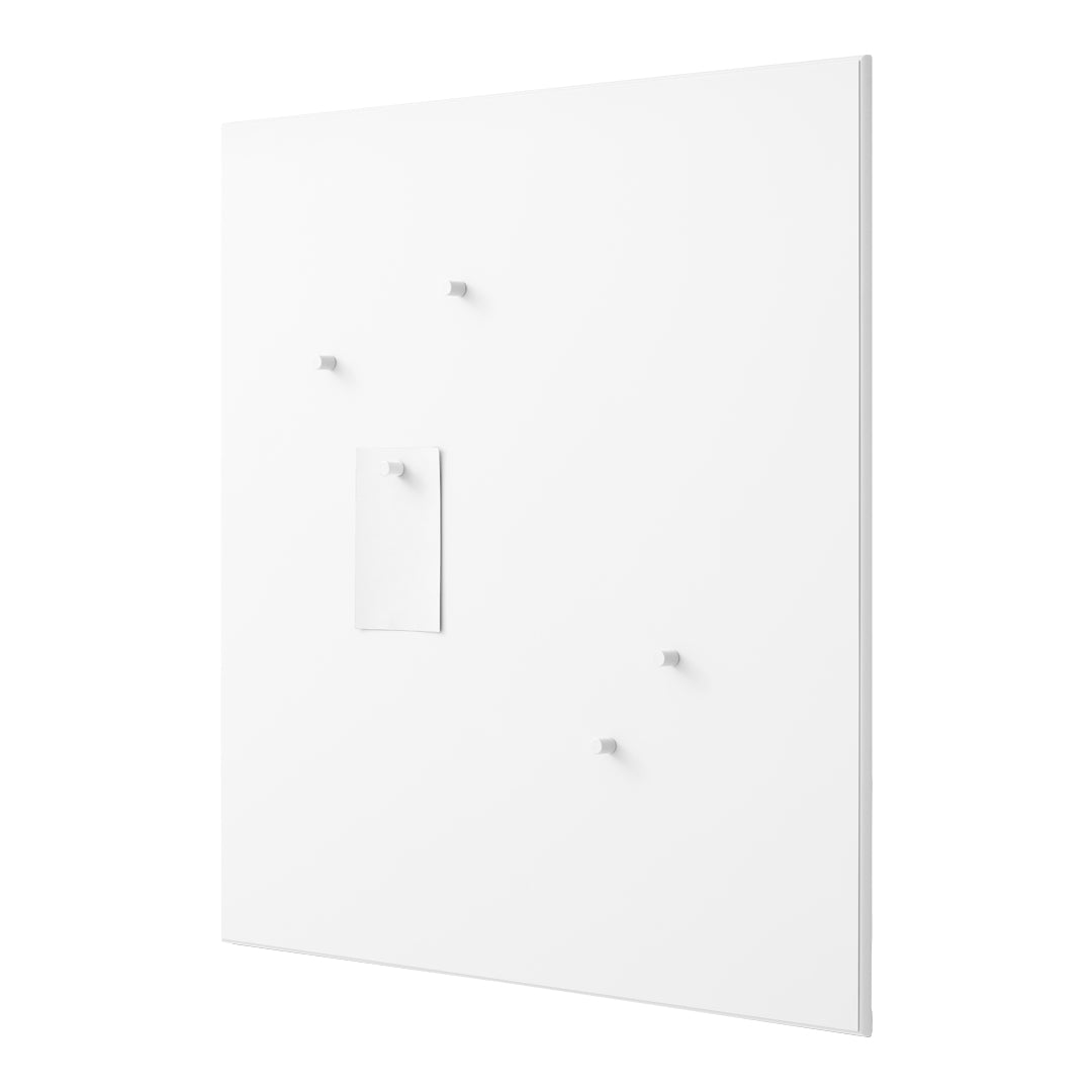White wall with minimalist design featuring subtle textures and small protruding hooks.