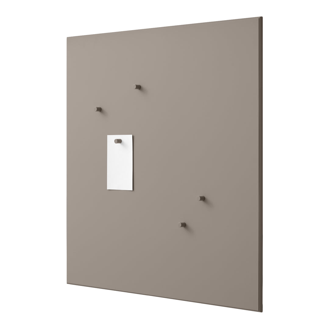 Neutral taupe wall panel with subtle texture and four matching hooks, featuring a contrasting white memo holder.