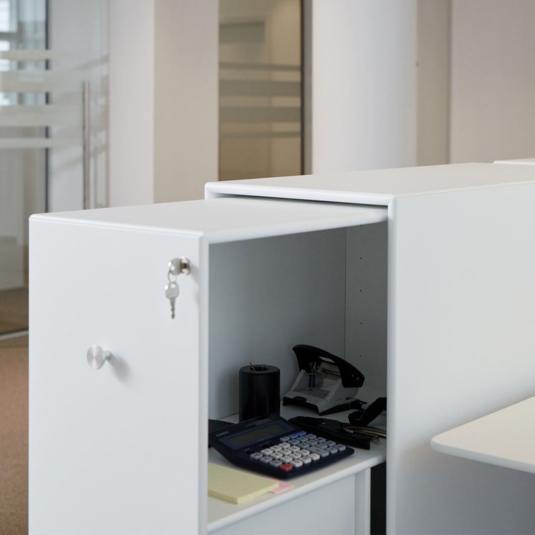 White office cabinet with sleek design and subtle textures, featuring a minimalist look and modern vibe.