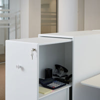 White office cabinet with sleek design and subtle textures, featuring a minimalist look and modern vibe.