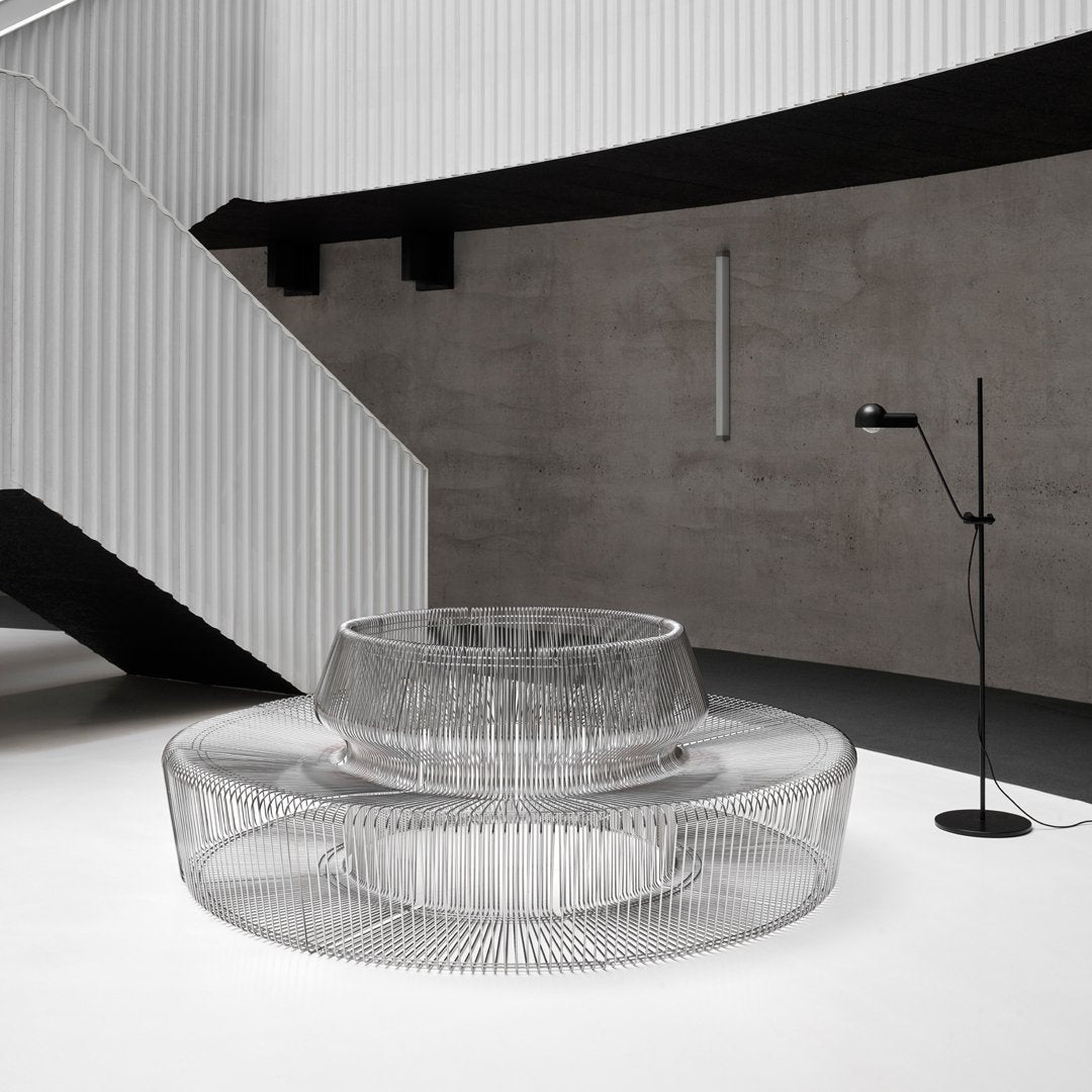 Stylish transparent coffee table with a modern circular design, featuring sleek lines and a minimalist aesthetic.