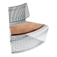 Modern wire chair with a sleek chrome finish and warm brown leather seat, featuring a unique curved design.